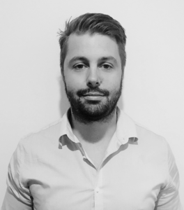 Black and white headshot of Dr. Stephen McCullan, a specialist orthodontist, wearing a professional suit